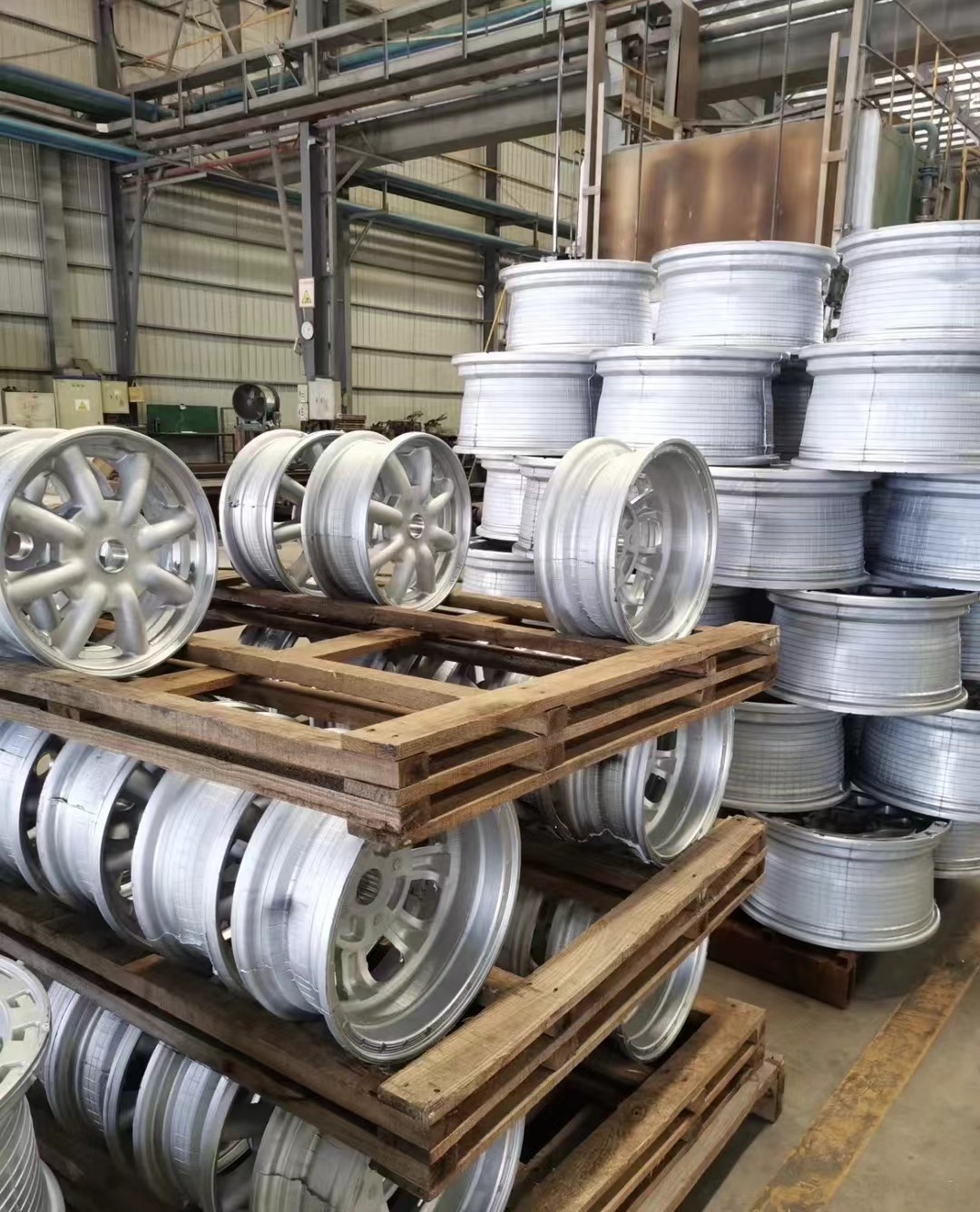 Alloy wheel forming operation with tooling and production fixtures