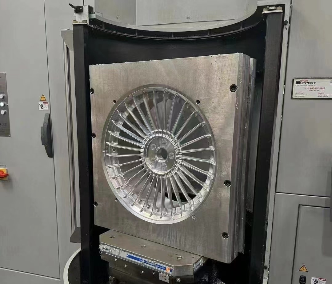 Alloy wheel surface finishing and coating booth