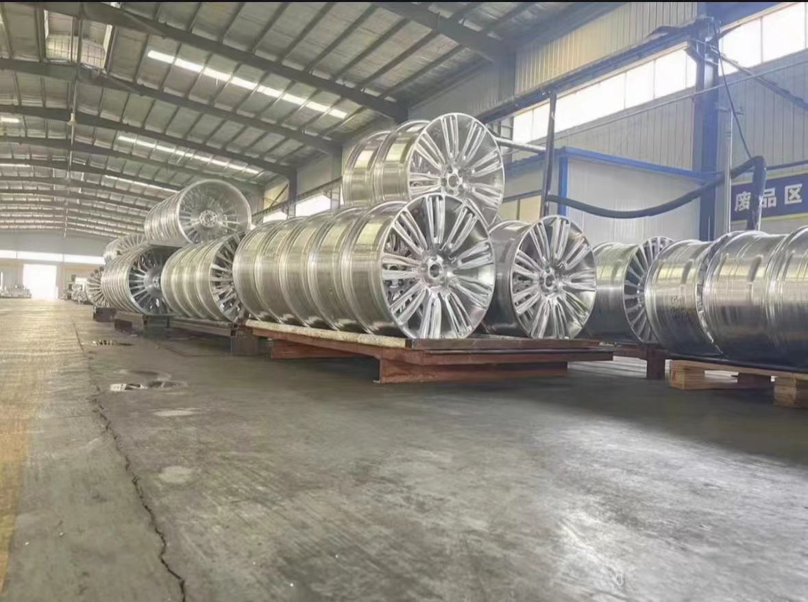 CNC production area with wheel machining equipment and workstations