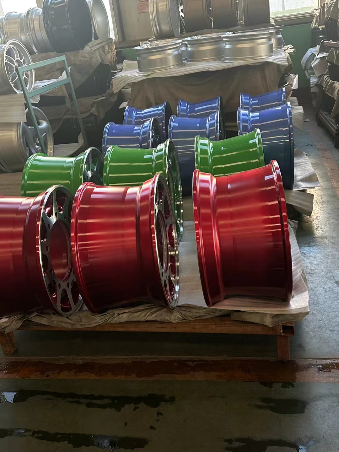 Aluminum billet rounds staged for forged wheel manufacturing