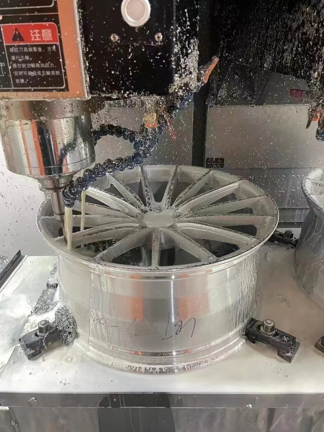 Machined alloy wheel inspection before finishing