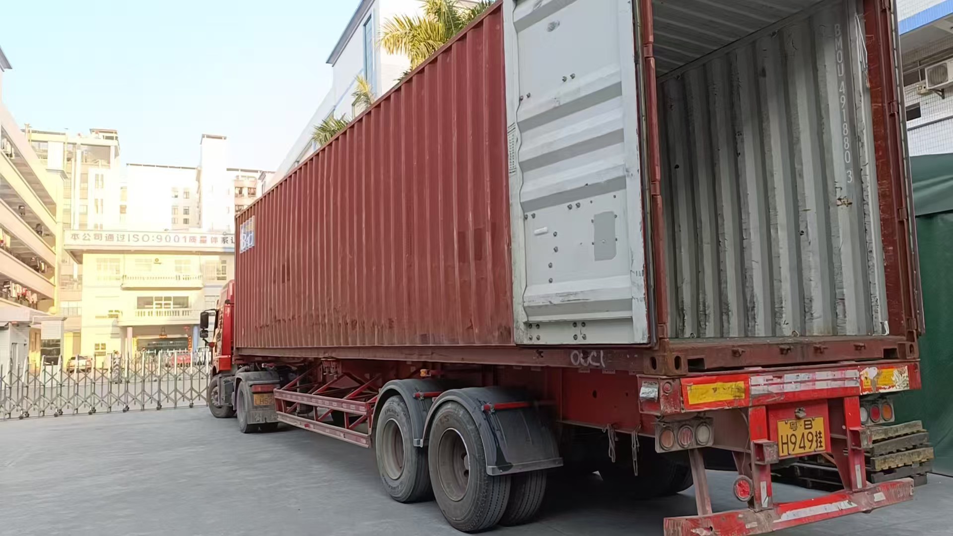 Rear view of an export container loaded with alloy wheel cartons
