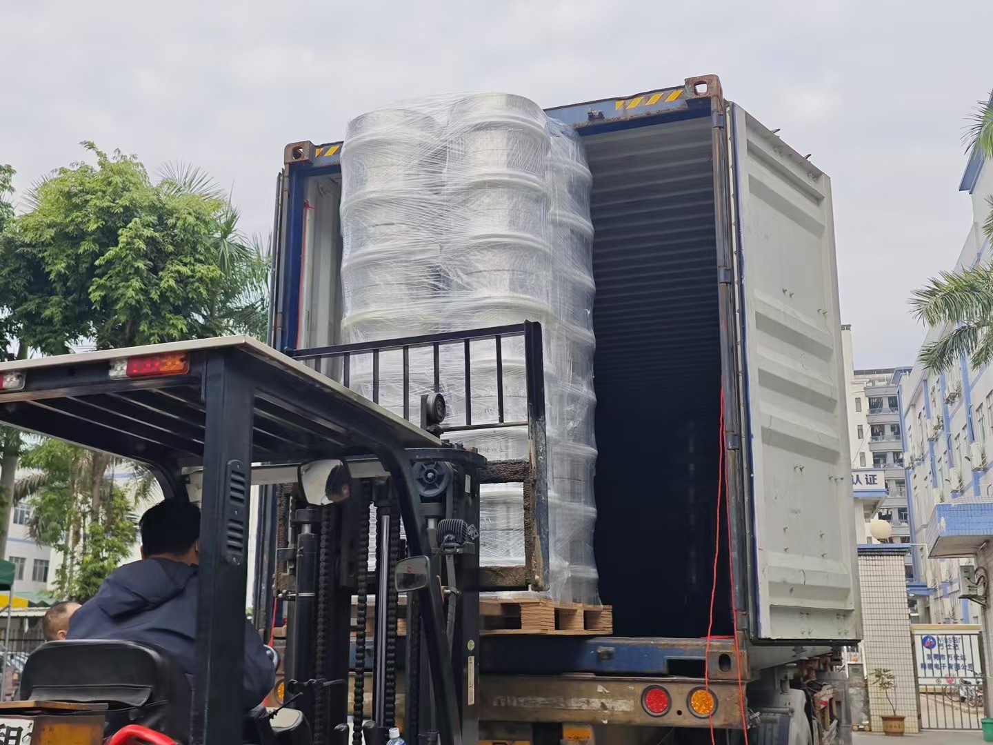 Cartons arranged inside a delivery truck for alloy wheel shipment